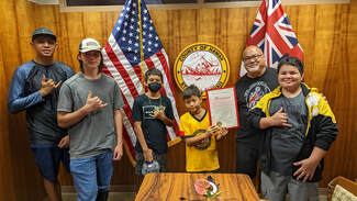 Picture of youth from afterschool program with the proclamation 